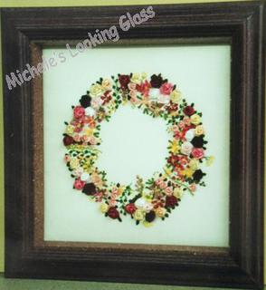 Two hand finished frames, inner one lifts glass off needlework