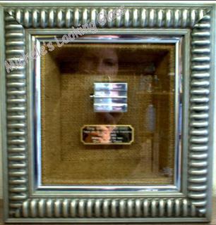 Two silver frames,  third inner box frame and mountboard covered with material
