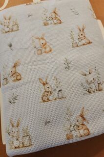 Cute bunnies on grey linen