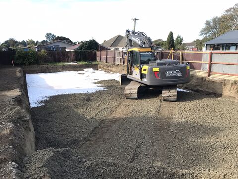 Backfilling an excavated house foundation, Christchurch 