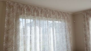 Pencil pleated sheer curtains on single track