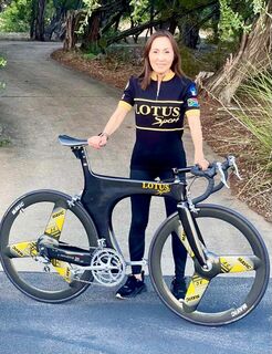Akiko with her Lotus jersey and bike